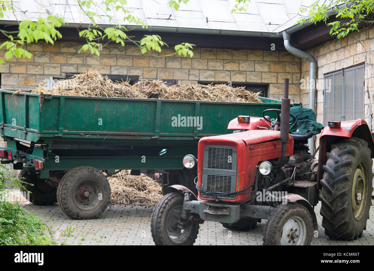 CLose up on tractor with the barn Stock Photo