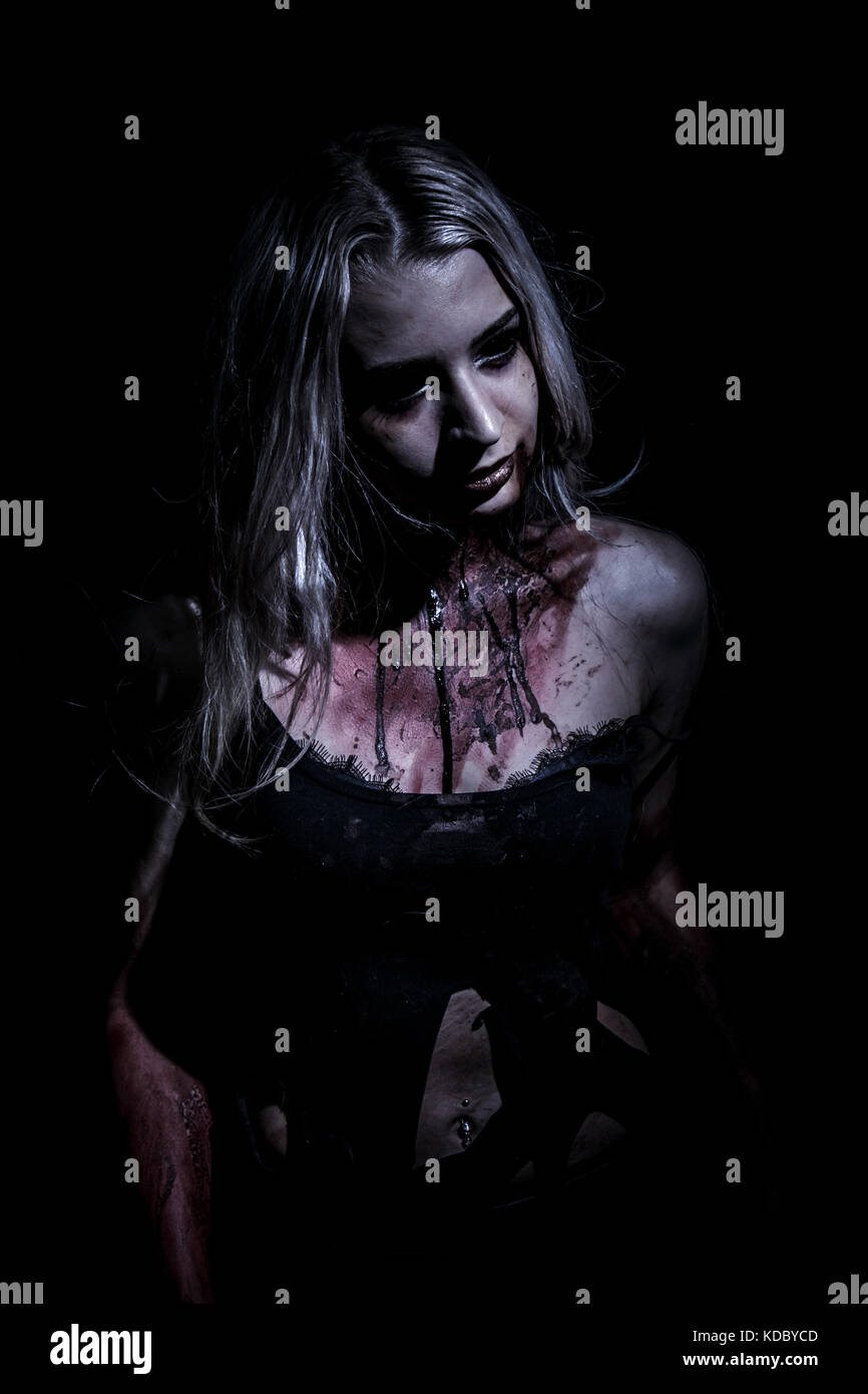 Walking dead woman over black background Stock Photo