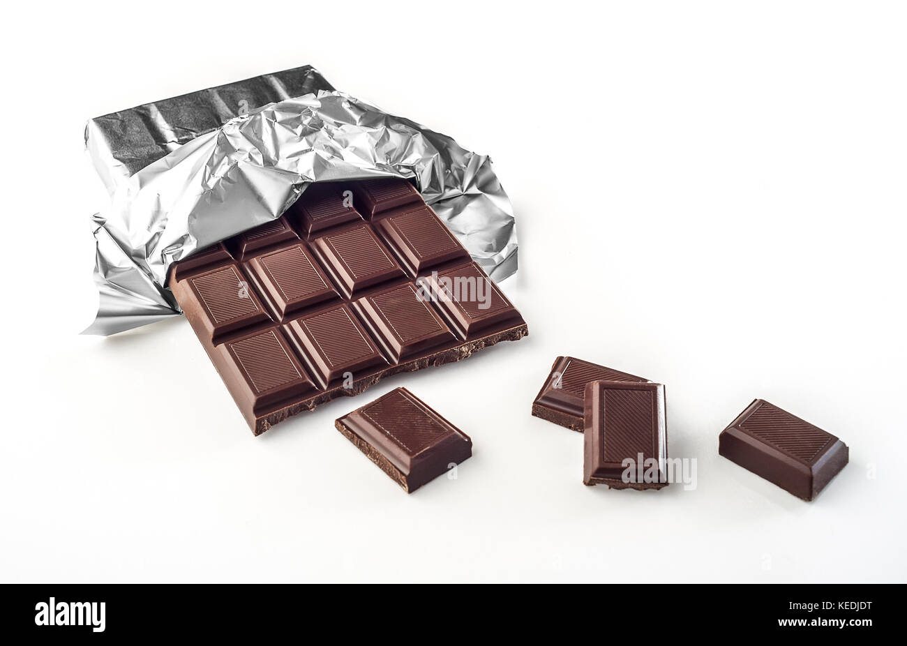 Chocolate bar in wrapper isolated on white background Stock Photo