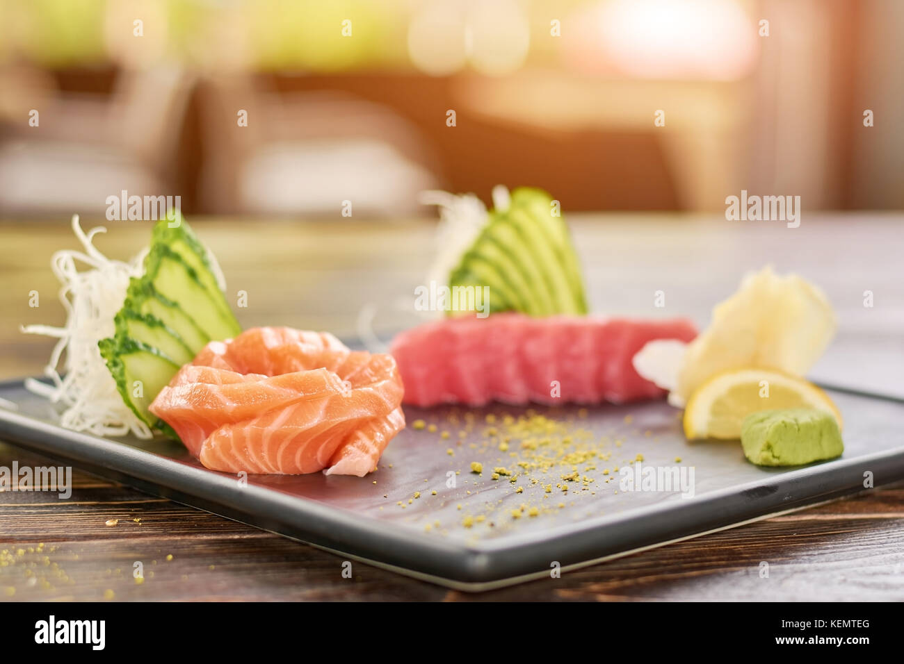 Fresh fish sashimi set. Raw salmon and tuna sashimi served with cucumber, salmon and wasabi. Stock Photo