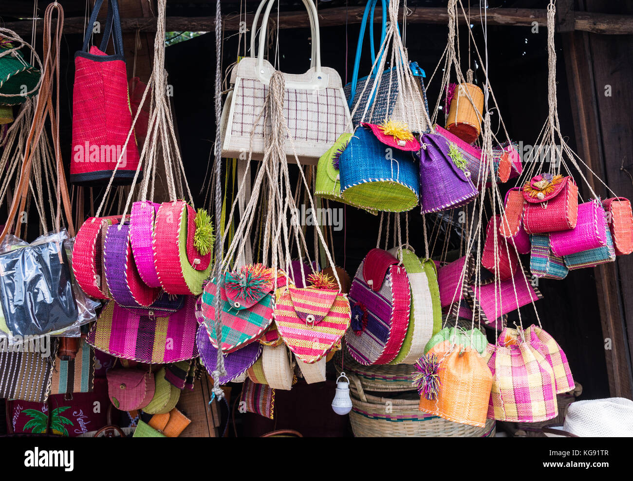 Colorful hand-made purses and handbags for sale at a local market. Madagascar, Africa. Stock Photo