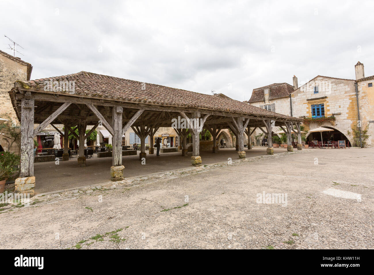 Monpazier  main square with the old covered market place,  Dordogne department, Nouvelle-Aquitaine, France. Stock Photo