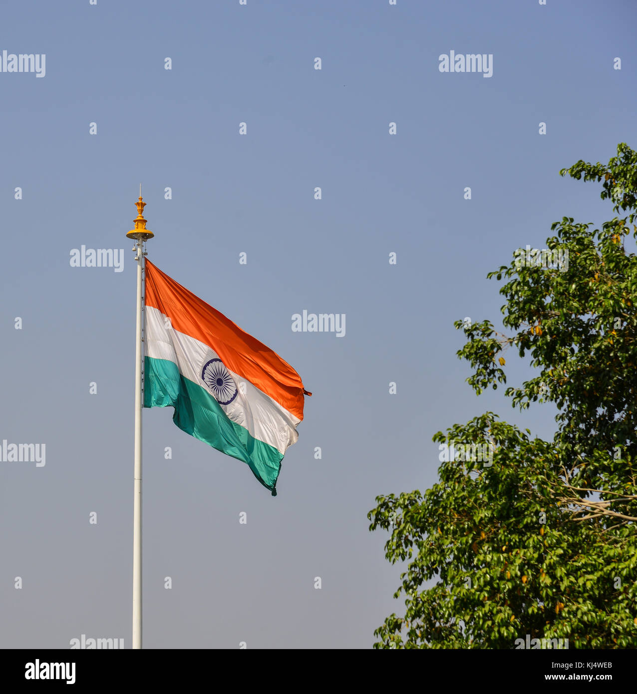 An Indian flag flying at sunny day in Jaipur, India. A parliamentary republic of India with a multi-party system, it has seven recognised national par Stock Photo