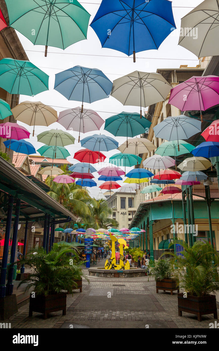 Colourful umbrellas hanging over the shopping mall Caudan Waterfront in Port Louis, Mauritius, Africa. Stock Photo