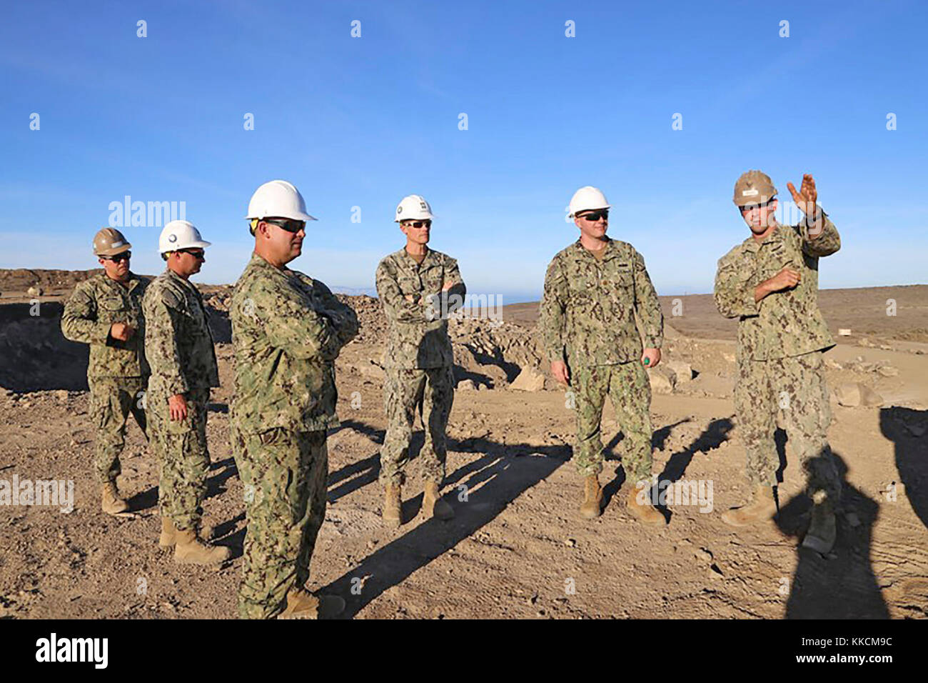 SAN CLEMENTE ISLAND, Calif. (Nov. 21, 2017) – Equipment Operator 2nd Class Tanner (right), assigned to Naval Mobile Construction Battalion (NMCB) 4, speak with NMCB 4 leadership on quarry and crusher plant operations. Wolfson explains the progress with material that has been crushed on the pioneer jaw and cone crusher plant and plans for future quarry operations.  San Clemente Island hosts the only active quarry operations in the Naval Construction Force where Seabees can train and take this capability forward during Major Combat Operation response. (U.S. Navy photo by Equ Stock Photo