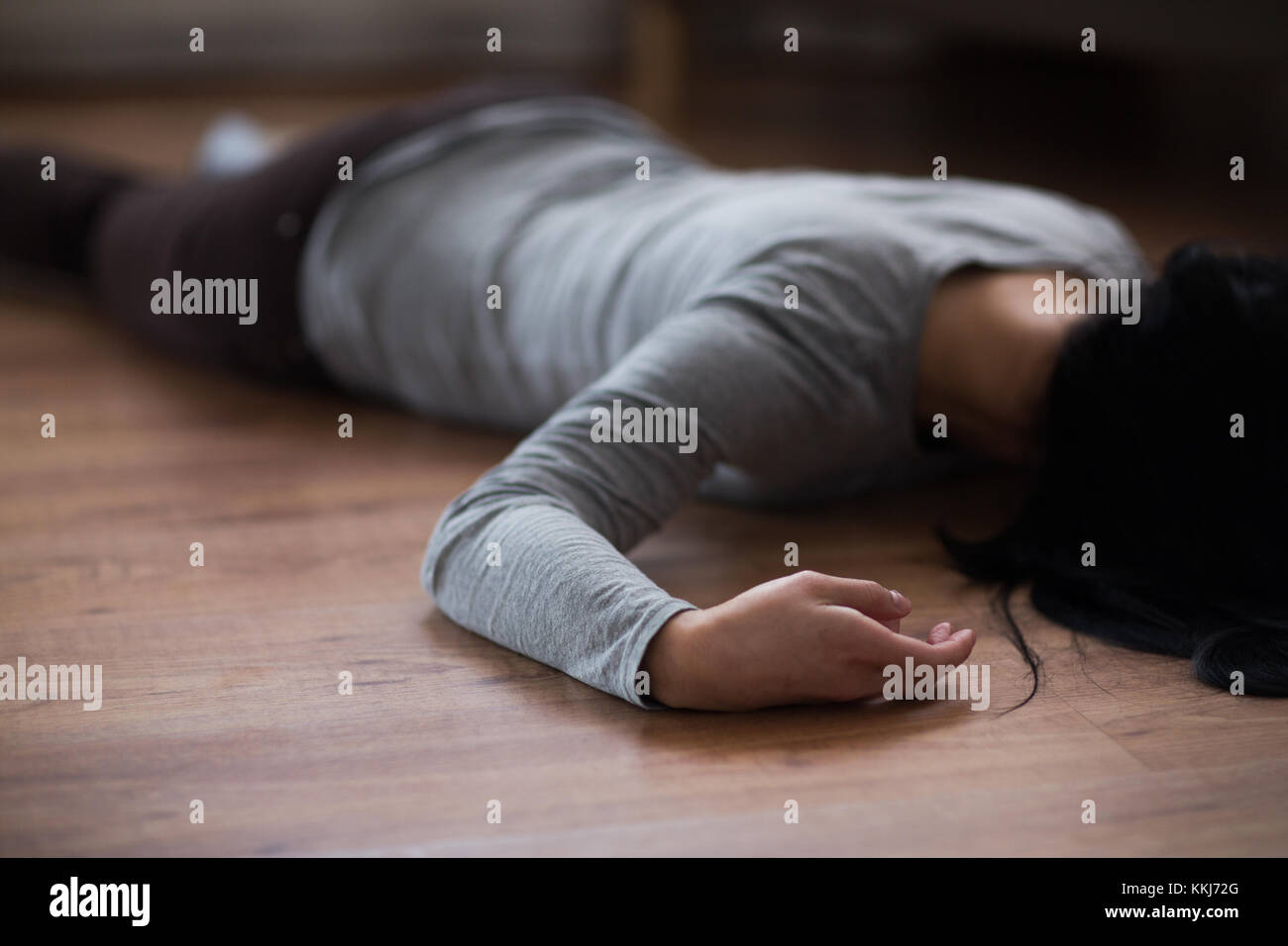 dead woman body lying on floor at crime scene Stock Photo