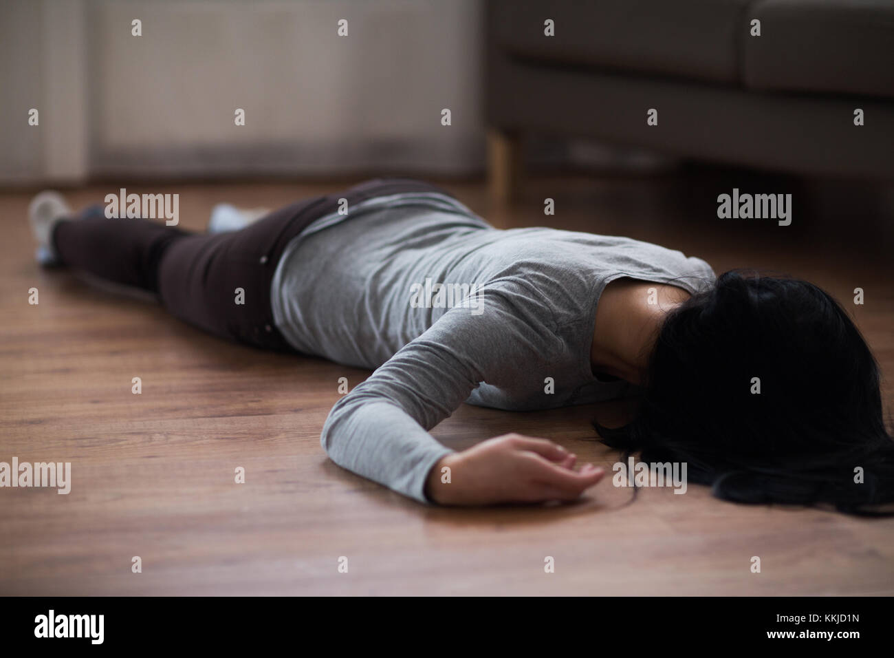 dead woman body lying on floor at crime scene Stock Photo