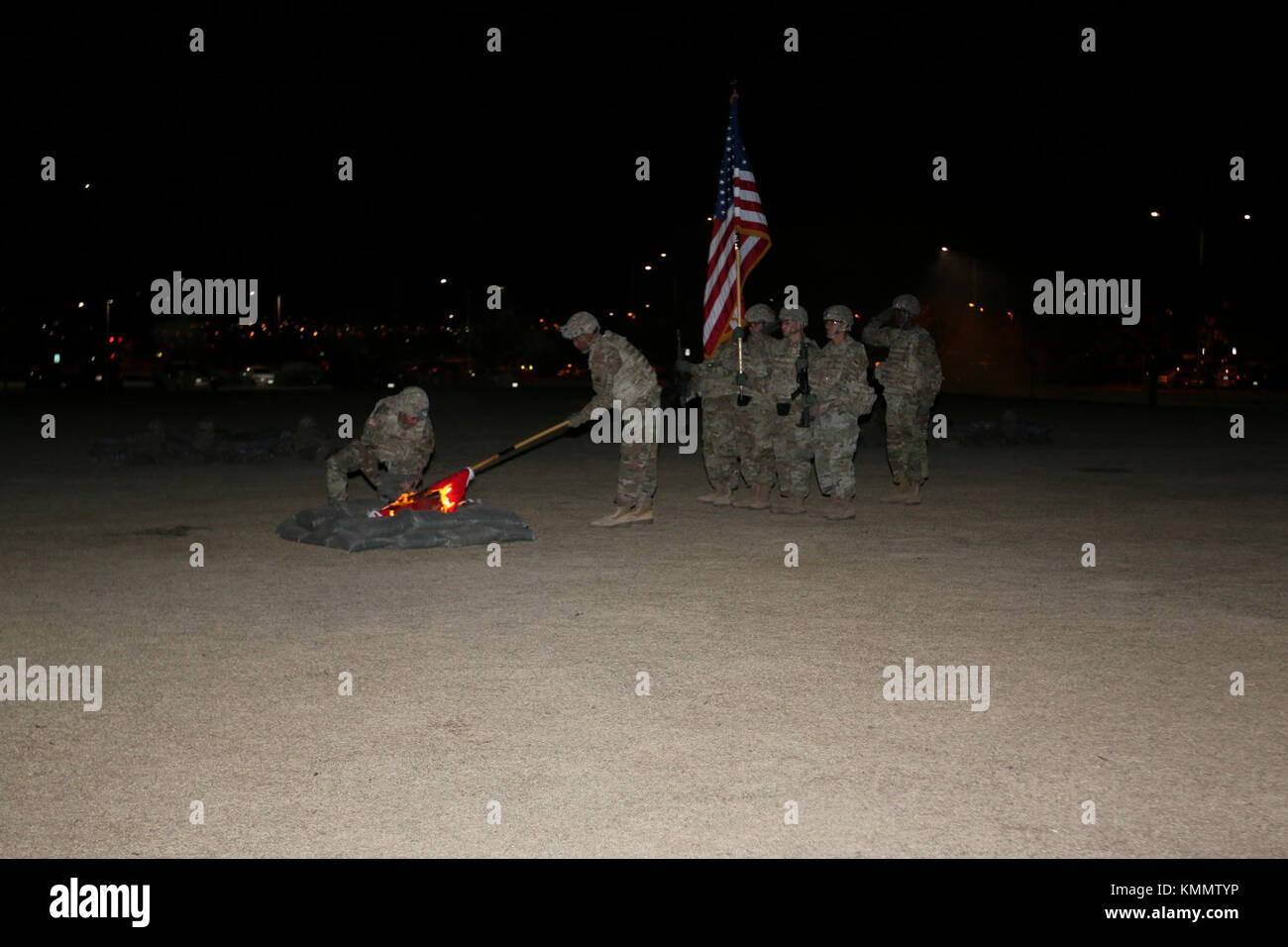 Soldiers with 2nd Engineer Battalion participate in the 67th Anniversary of the Burning of the Colors and a reenactment of the Battle of Kunu-Ri during the Korean War at Bulldog Field, Fort Bliss, Texas, Nov. 30. They put out the flames of the battalion colors after ceremonially burning them, as they did in 1950. (U.S. Army Stock Photo