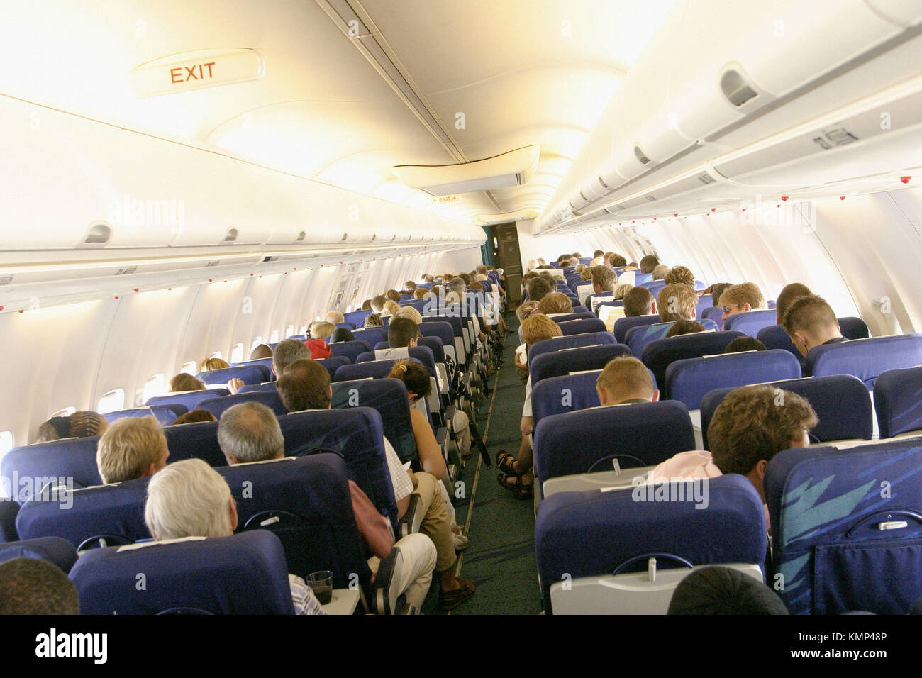 Passengers in aeroplane during flight Stock Photo - Alamy