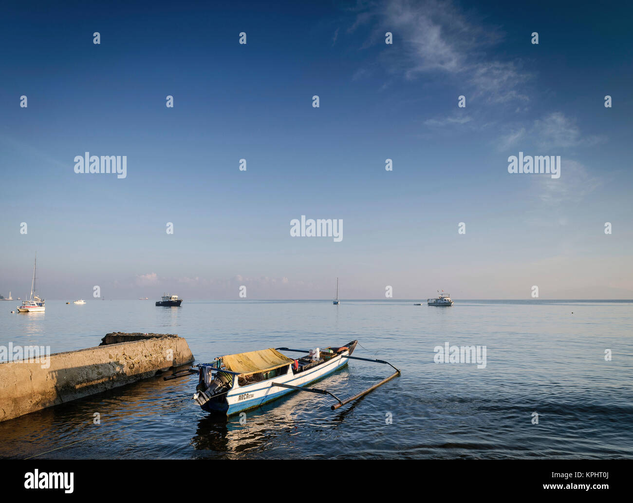 coast with traditional fishing boats on dili beach in east timor leste Stock Photo