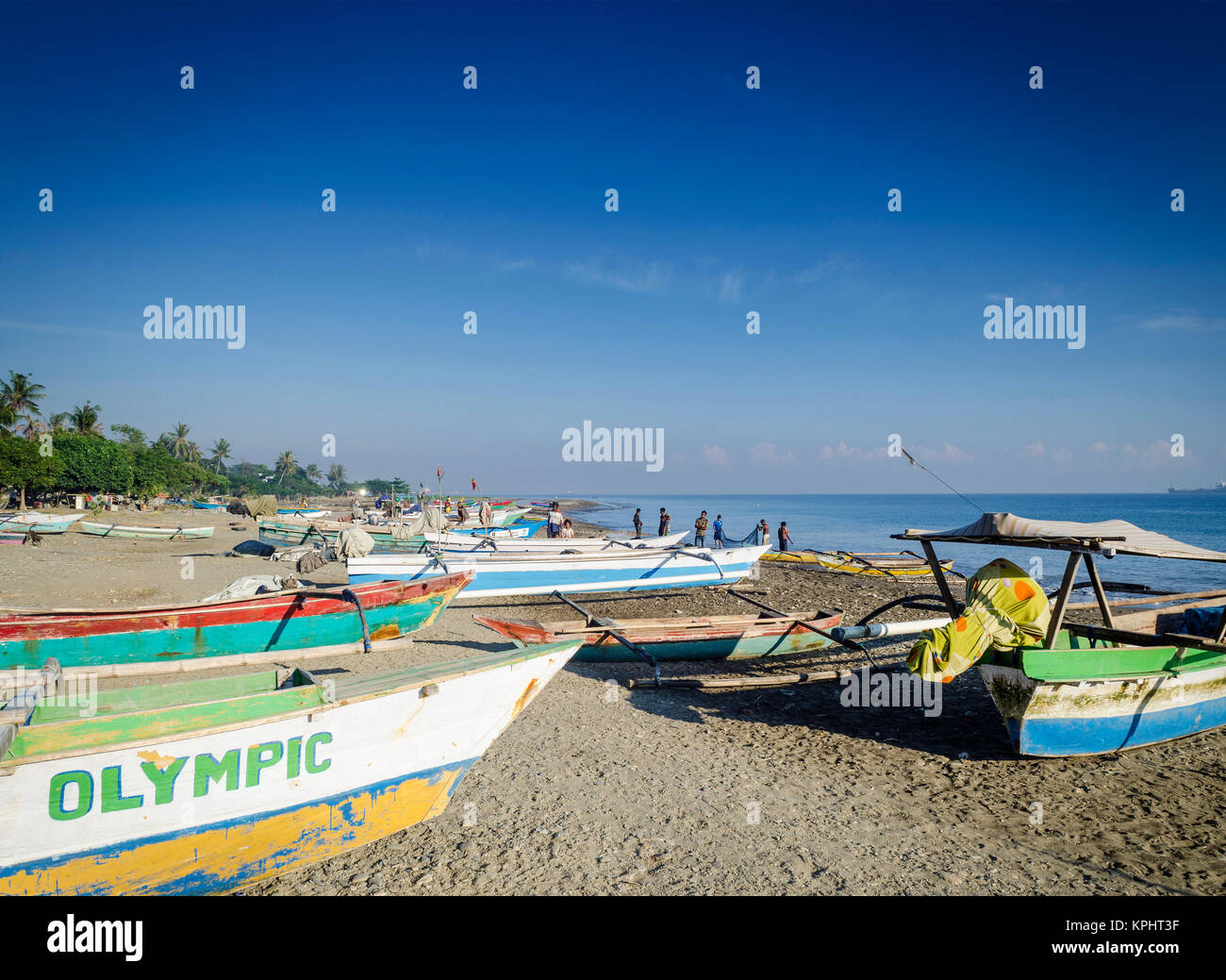 coast with traditional fishing boats on dili beach in east timor leste Stock Photo