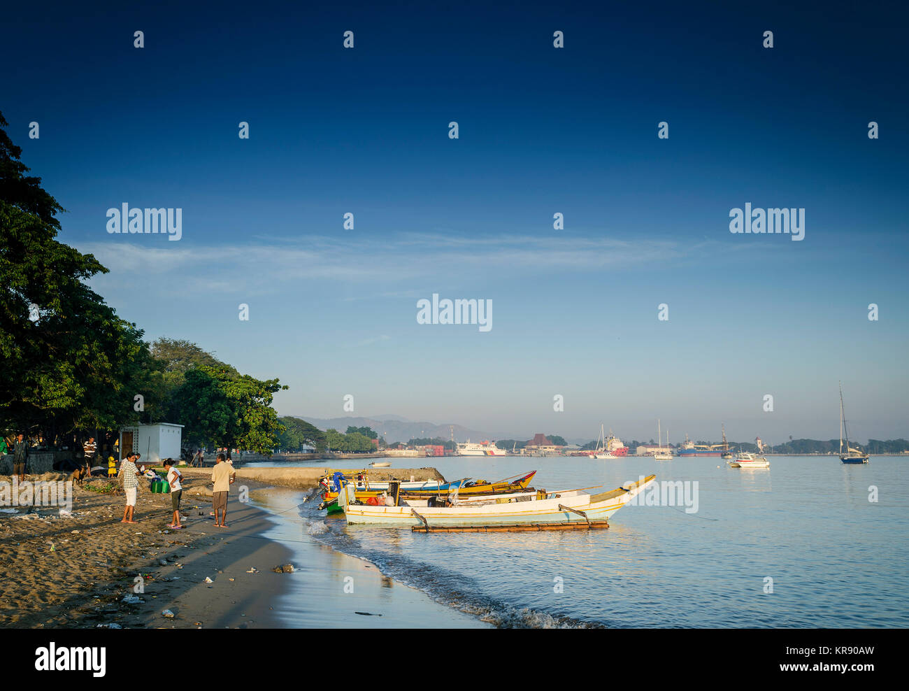 coast with traditional fishing boats on dili beach in east timor leste Stock Photo