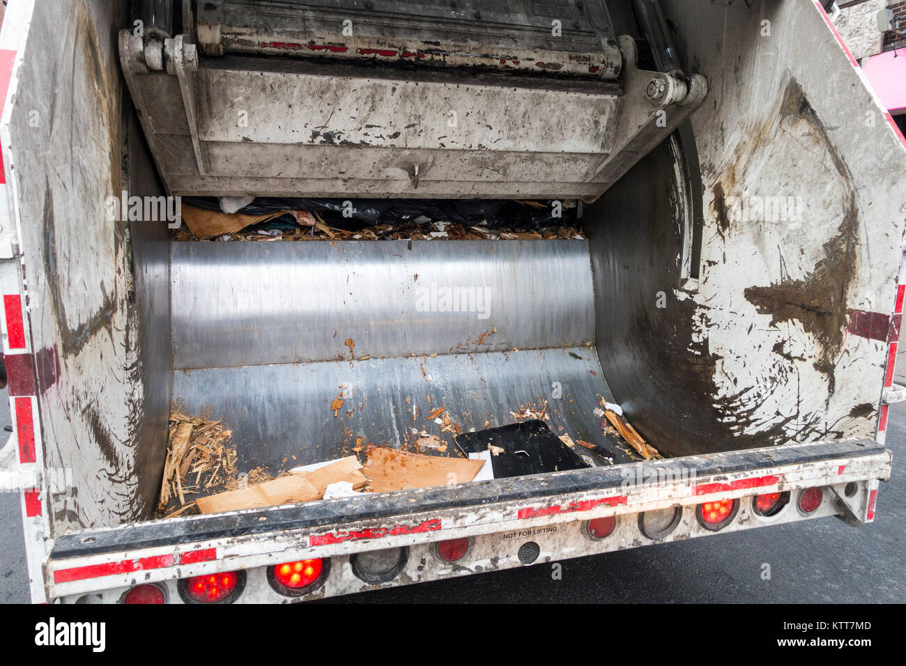 urban trash truck back hydrolic crusher Stock Photo