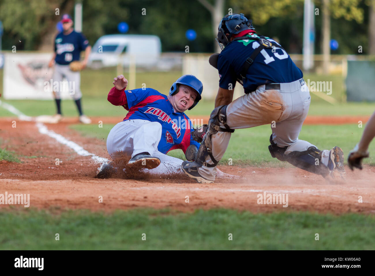 ZAGREB, CROATIA - SEPTEMBER 09, 2017: Baseball match between Baseball Club Zagreb and BK Olimpija 83. Baseball runner sliding on home base Stock Photo