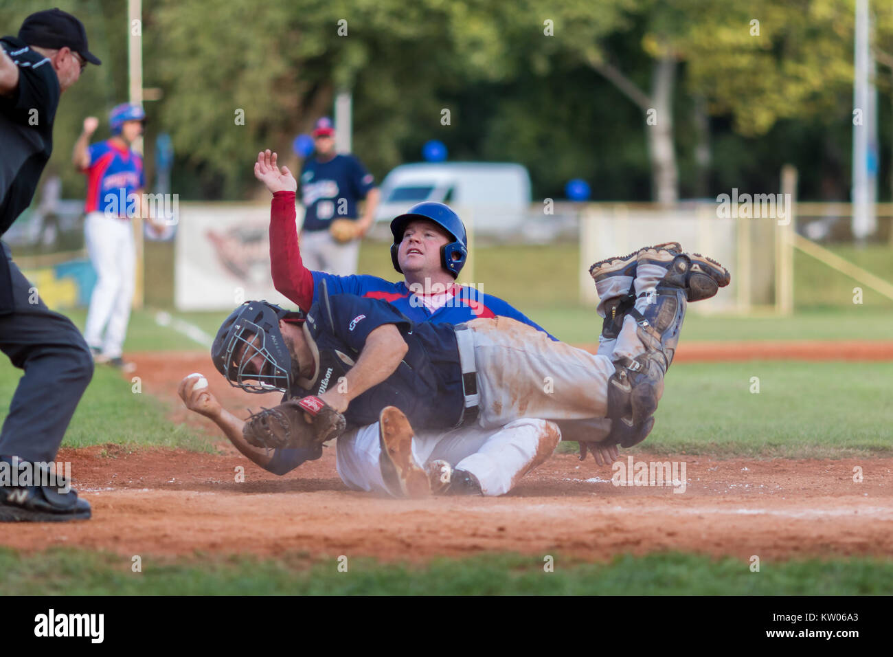 ZAGREB, CROATIA - SEPTEMBER 09, 2017: Baseball match between Baseball Club Zagreb and BK Olimpija 83. Baseball runner sliding on home base Stock Photo