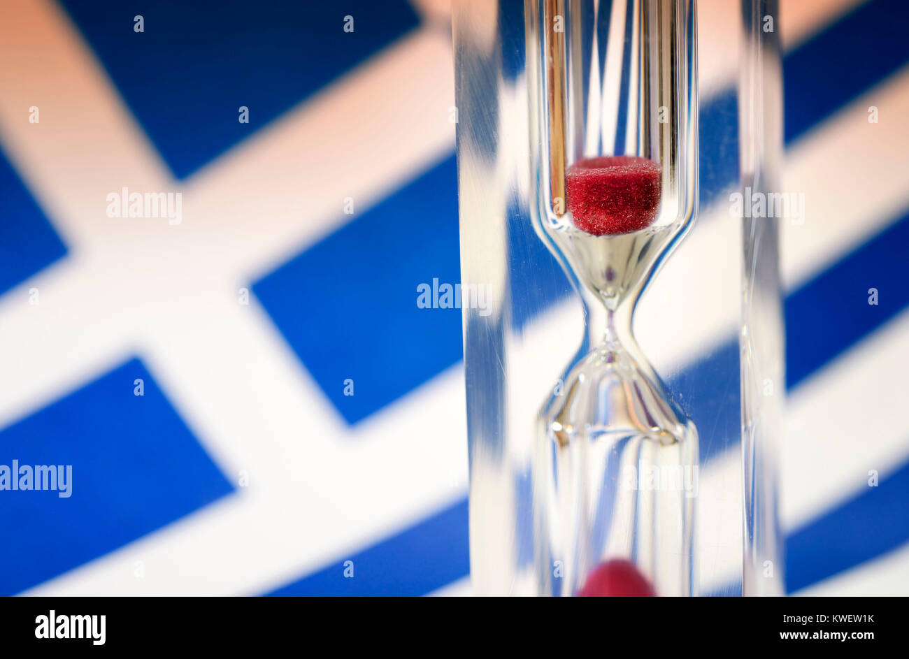 Greek flag and hourglass, symbolic photo Greek debt crisis, Griechische Fahne und Sanduhr, Symbolfoto griechische Schuldenkrise Stock Photo