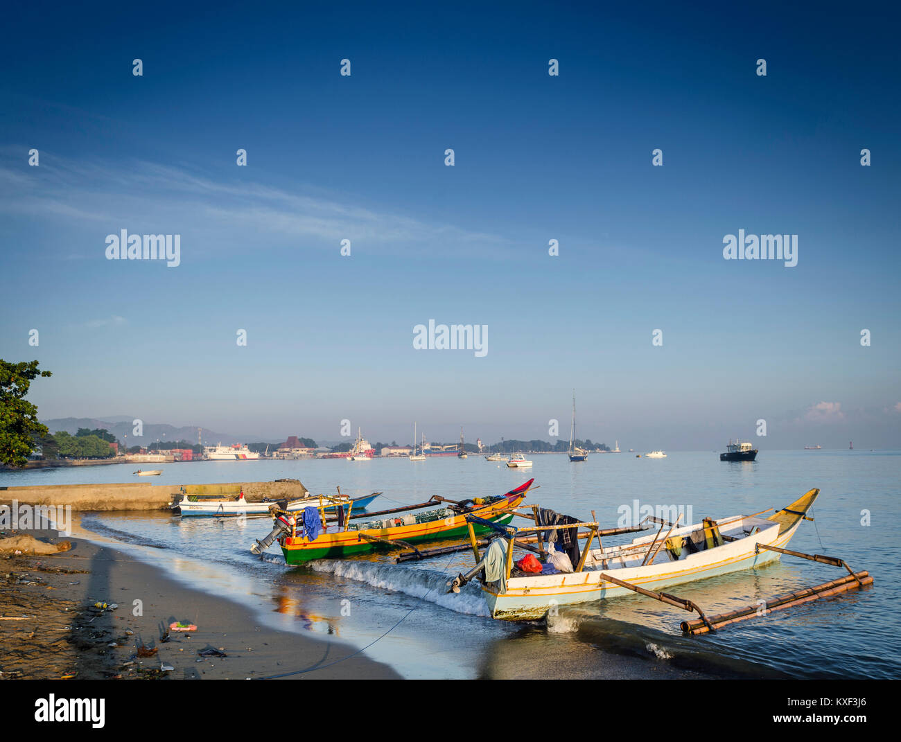 coast with traditional fishing boats on dili beach in east timor leste Stock Photo