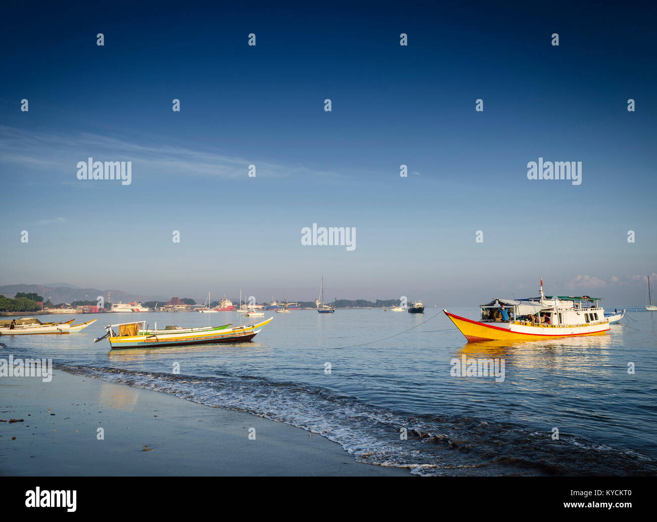 coast with traditional fishing boats on dili beach in east timor leste Stock Photo