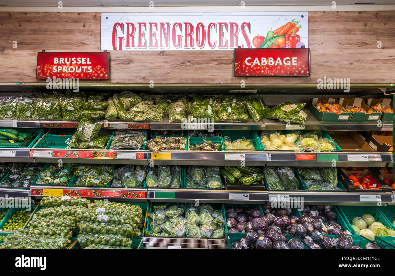 Morrisons supermarket. The greengrocers display area, with a variety of vegetables etc on racks. Stamford, Lincolnshire, England, UK. Stock Photo