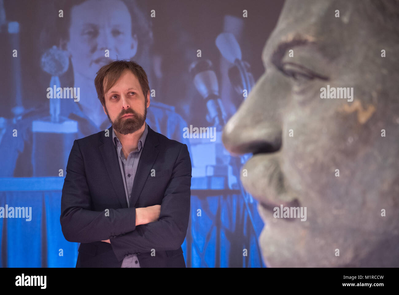 Berlin, Germany. 17th Jan, 2018. A bust of the General Secretary of the Central Committee of the Communist Party of the Soviet Union, Josef Stalin, is exhibited during a special exhibition at the Berlin-Hohenschoenhausen Memorial in Berlin, Germany, 17 January 2018. The curator of the exhibition Andreas Engwert can be seen in the background. A new exhibition in Berlin deals with cult surrounding Stalin in the former German Democratic Republic. Credit: Ralf Hirschberger/dpa-Zentralbild/dpa/Alamy Live News Stock Photo