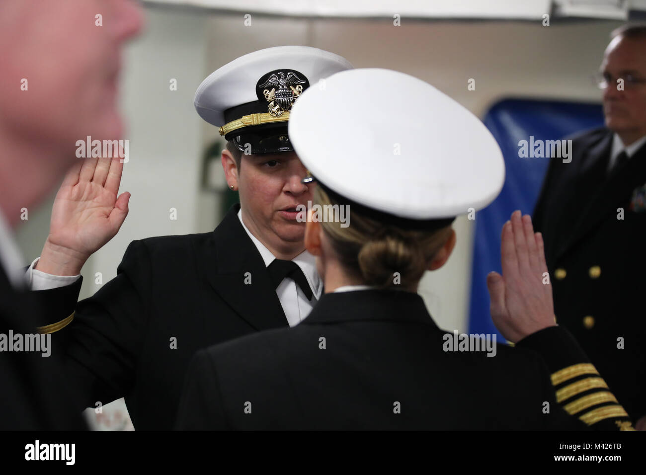 NORFOLK, Va. (Feb. 3, 2018) --  Ensign Melissa Howard recites the oath of office during her commissioning ceremony. Howard was commissioned as a limited duty supply corps officer during a commissioning ceremony held onboard USS Gerald R. Ford (CVN 78) Feb. 3. (U.S. Navy photo by Mass Communication Specialist 1st Class Joshua Sheppard) Stock Photo