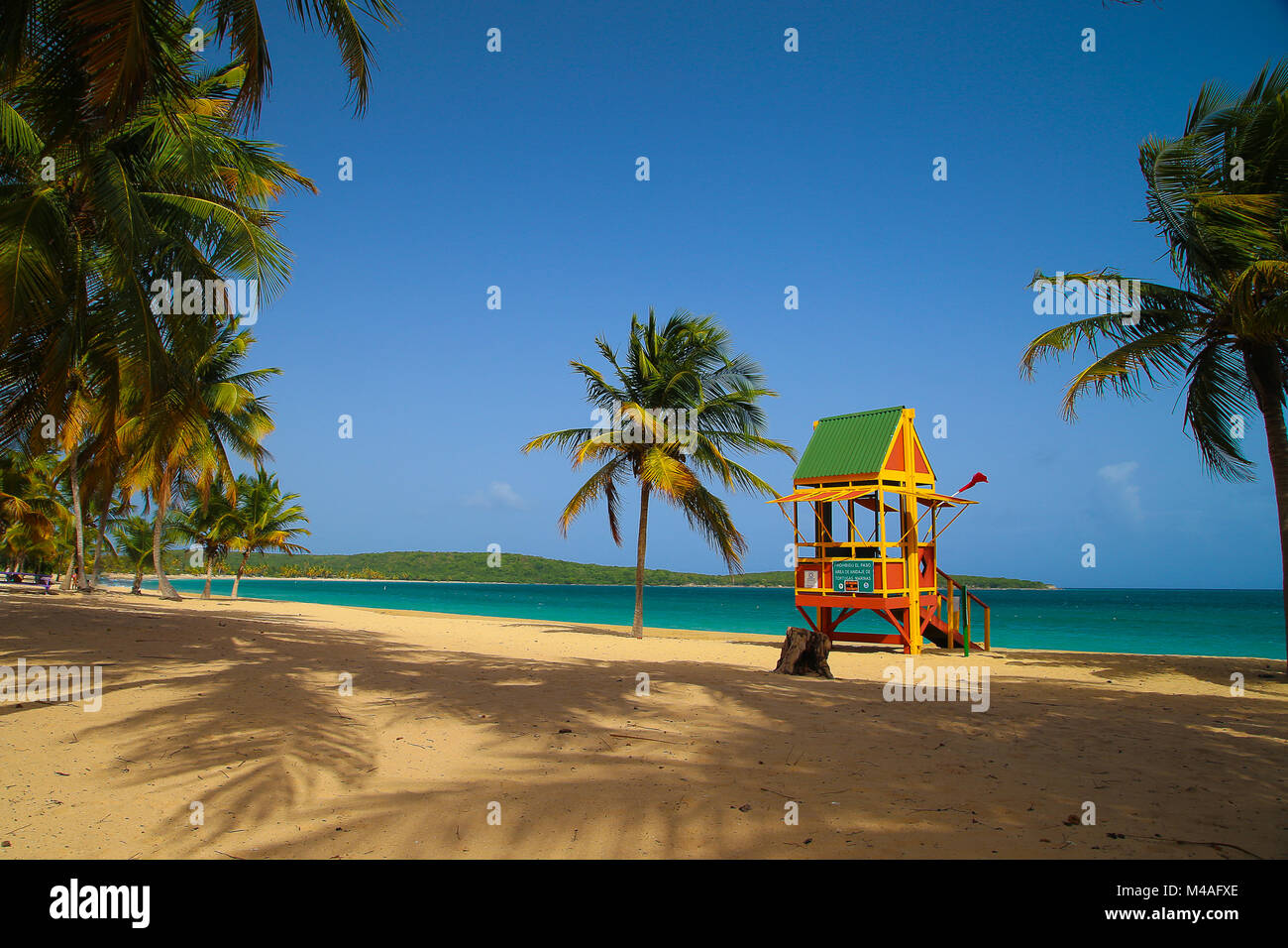 Sandy day on Sun Bay Beach in Vieques Puerto Rico. This lifeguard shack stands to protect the vacationers from the beautiful waters. Stock Photo