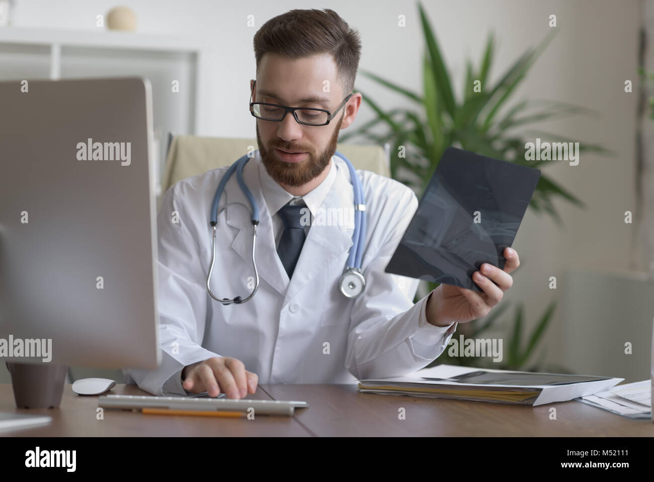 Doctor examining an elbow x-ray. Medicine and healthcare Stock Photo