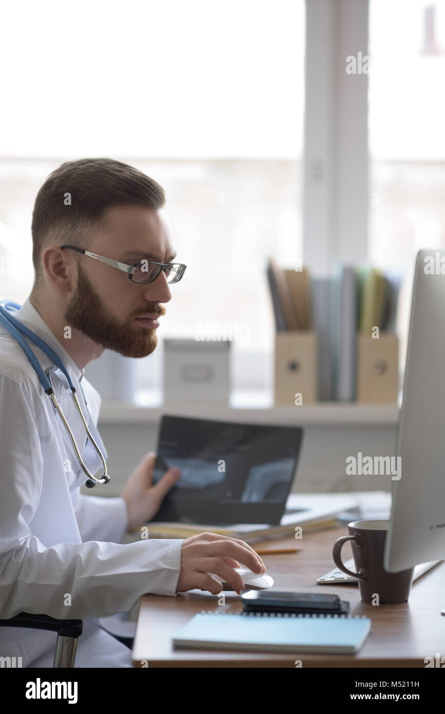 Doctor examining an elbow x-ray. Medicine and healthcare Stock Photo