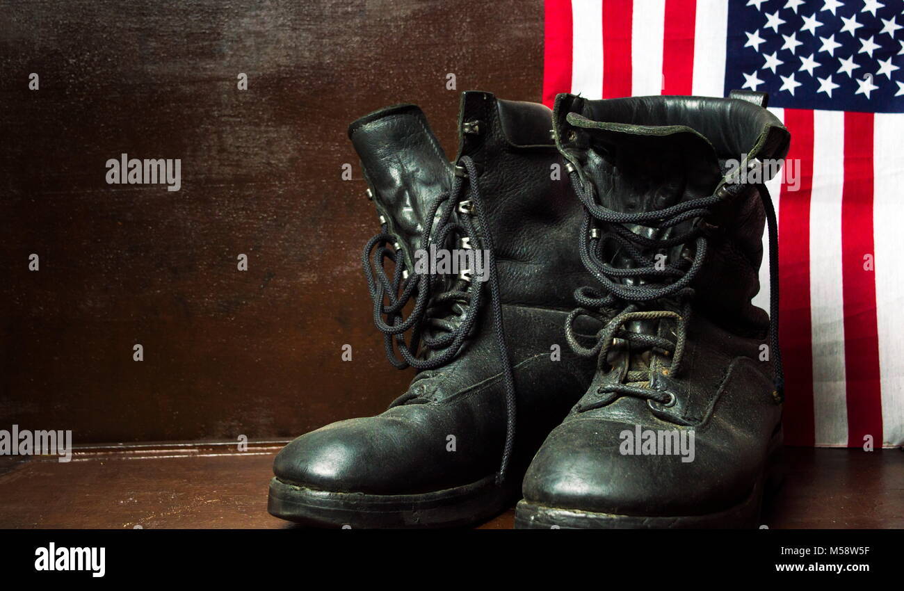 Old military army boots and USA flag Stock Photo