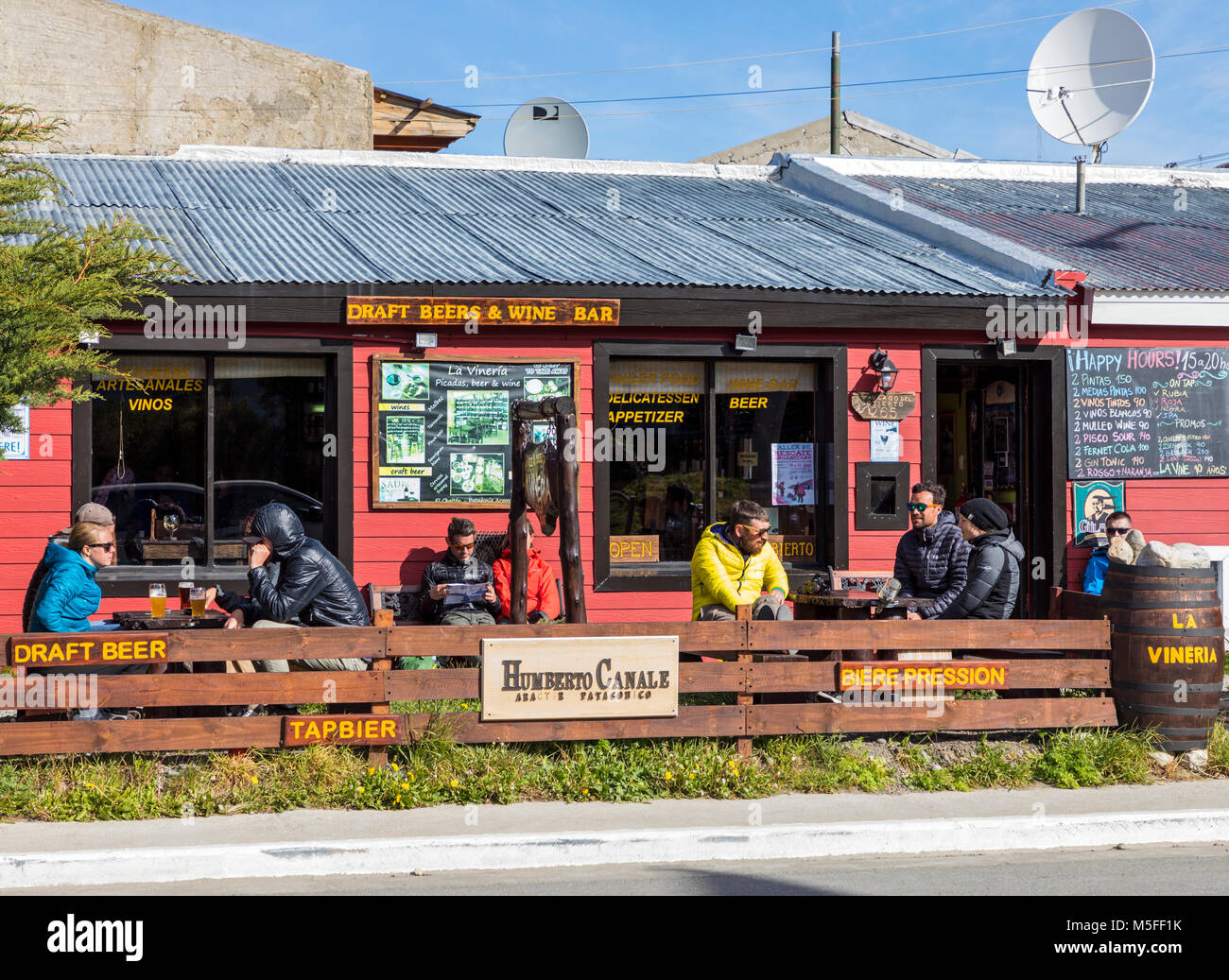 Visitors enjoy an outdoor cafe; small mountain village of El Chalten; jumping off point to Cerro Torre and Cerro Fitz Roy; Patagonia; Argentina Stock Photo