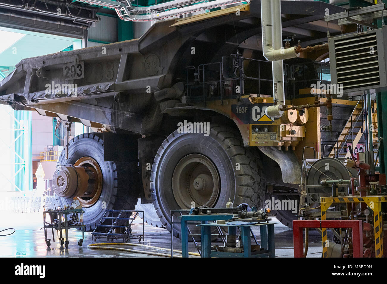 Tire changing on Caterpillar 793 at ArcelorMittal Mine, Fermont, Quebec Stock Photo