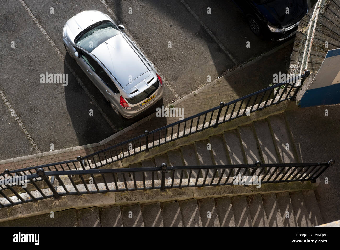 View looking down from top of steps overlooking Ramsgate Harbour onto the carpark beside the Sailors Church. Stock Photo