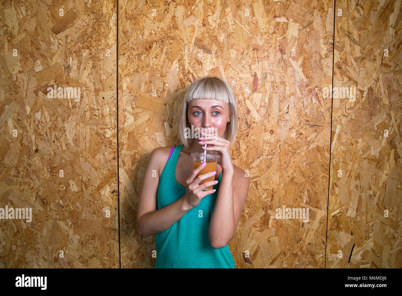 Caucasian woman drinking fruit juice Stock Photo