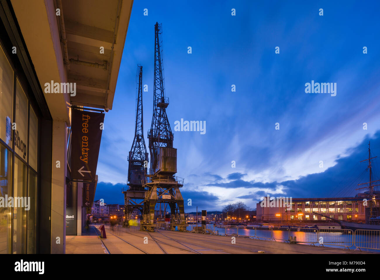 Cranes and the Bristol Harbour Railway at Princes Wharf outside the M Shed Museum beside the Bristol Floating Harbour, England. Stock Photo