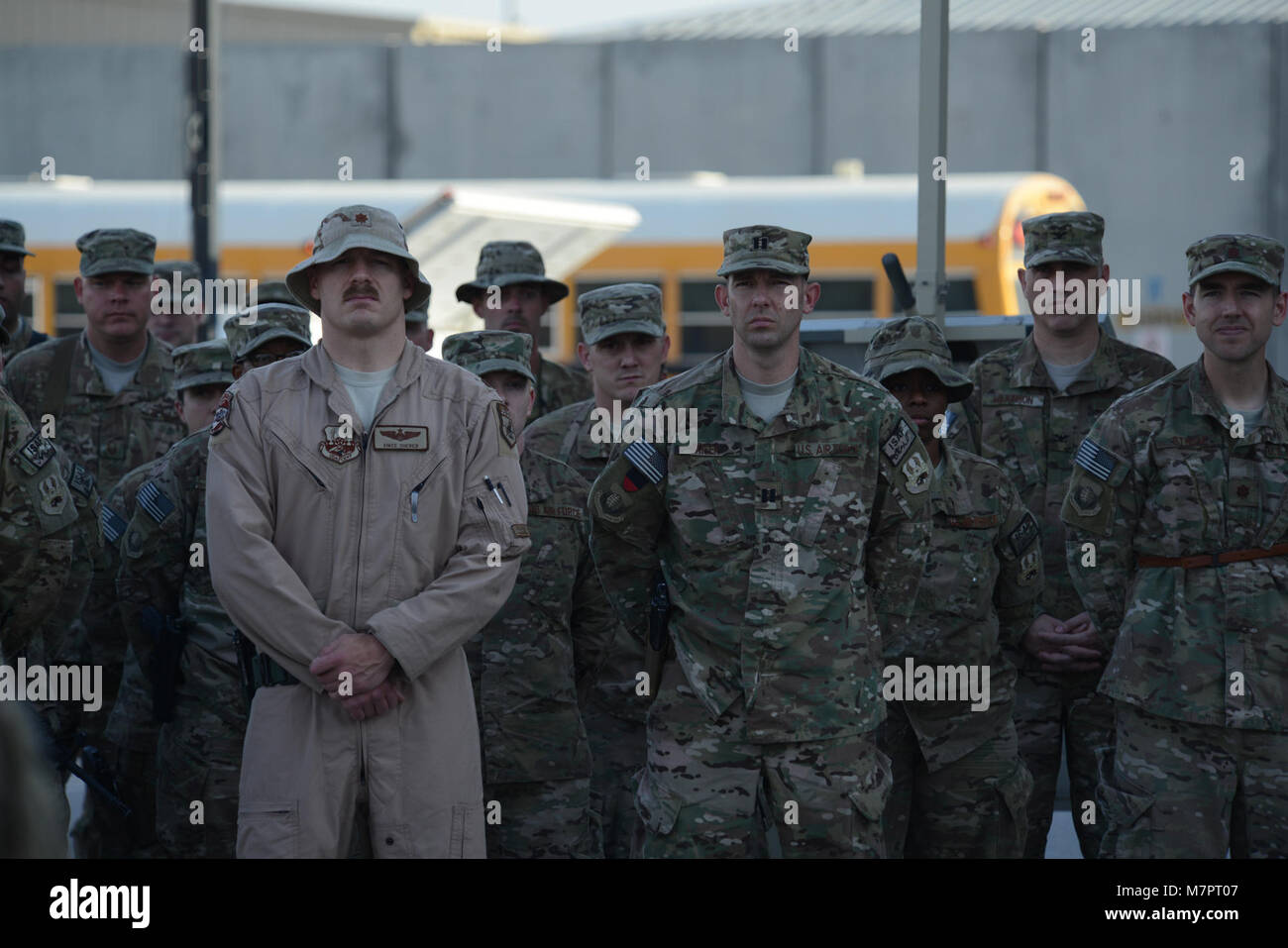 U.S. Air Force Airmen assigned to the 455th Air Expeditionary Wing stand at parade rest while listening to Brig. Gen. Mark D. Kelly, 455th Air Expeditionary Wing commander, during a retreat ceremony commemorating Patriot Day at Camp Cunningham, Bagram Airfield, Afghanistan Sept. 11, 2014. Patriot Day is remembered globally as the anniversary of the terrorist attacks in the United States Sept. 11, 2001. (U.S. Air Force photo by Master Sgt. Cohen A. Young/Released) 455th Air Expeditionary Wing Bagram Airfield, Afghanistan Stock Photo