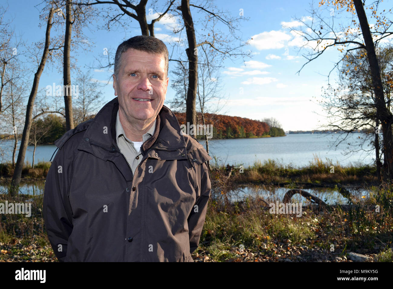 With the Humbug Marsh in the background, Detroit River International Wildlife Refuge Manager Dr. John Hartig proudly welcomes the Gateway Visitor Center groundbreaking. Photo by Tina Shaw/USFWS. Stock Photo