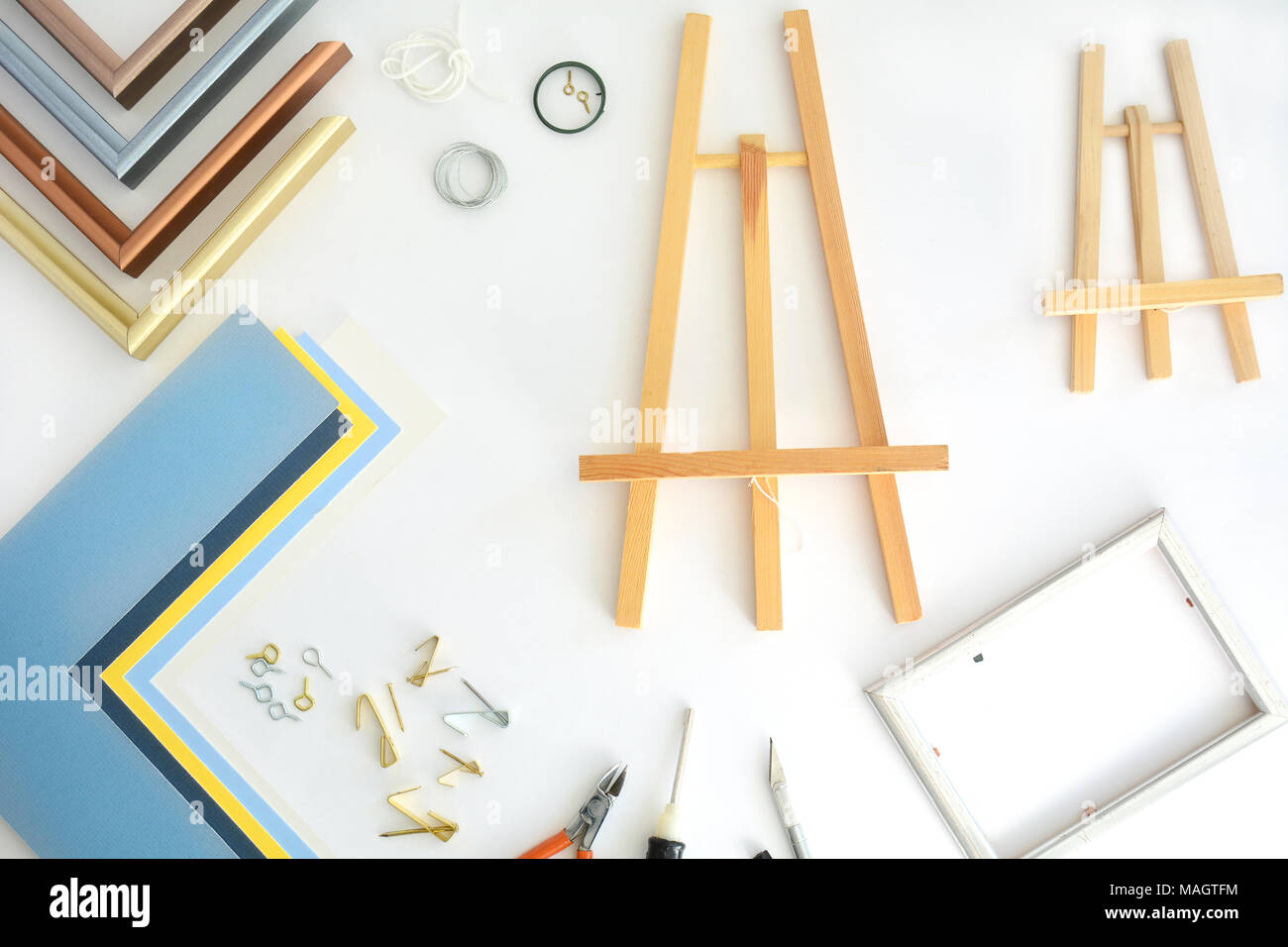 Assorted picture framing items shot from overhead in flat lay composition Stock Photo