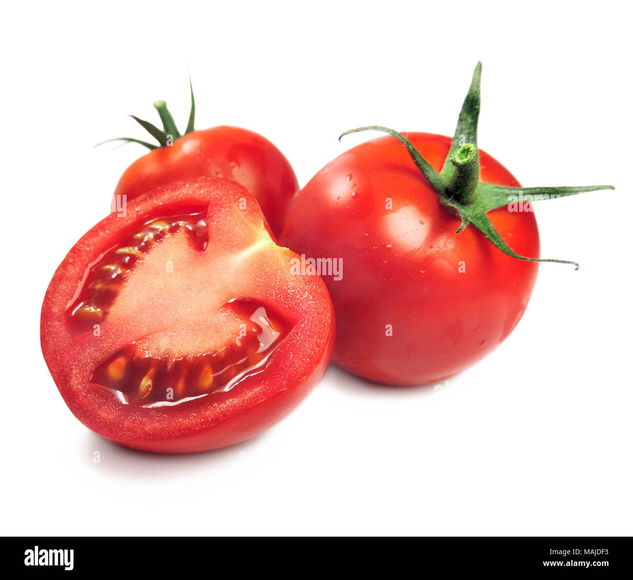 Ripe tomatoes or cherry tomatoes, isolated on white background. Fresh tomato slice and shoe tomatoes on white. Cooking ingredients. Stock Photo