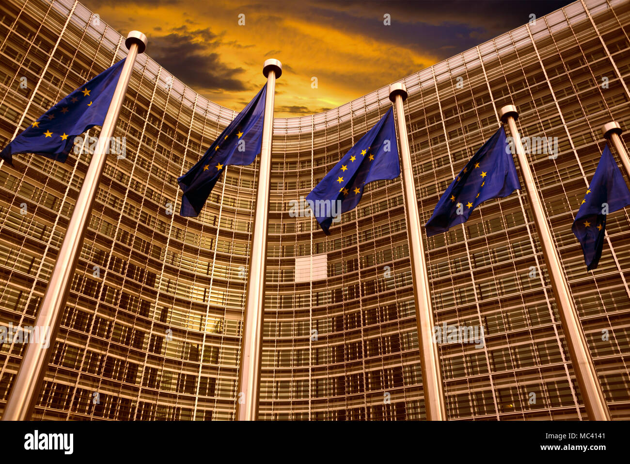 EU flags in front of European Commission building in Brussels Stock Photo