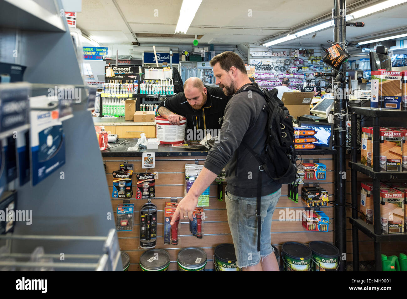 A customer asking a question in a DIY shop. Stock Photo