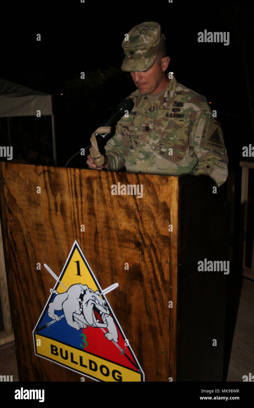 Lt. Col. Michael Loftus, commander, 2nd Engineer Battalion, 3rd Armored Brigade Combat Team, opens the ceremony honoring 67th Anniversary of the Burning of the Colors at Bulldog Field, Fort Bliss, Texas, Nov. 30. He welcomes members of the 2nd Engineers' Alumni Association, including Kunu-Ri Veterans, prisoners of war, and Family members. (U.S. Army Photo by Staff Sgt. Felicia Jagdatt) Stock Photo