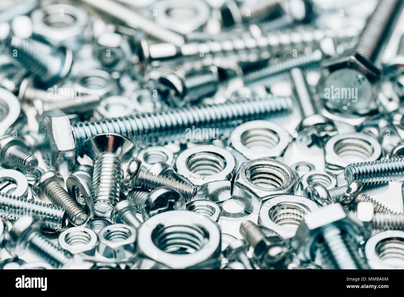 close up view of metal framing nails and capscrews isolated on white Stock Photo