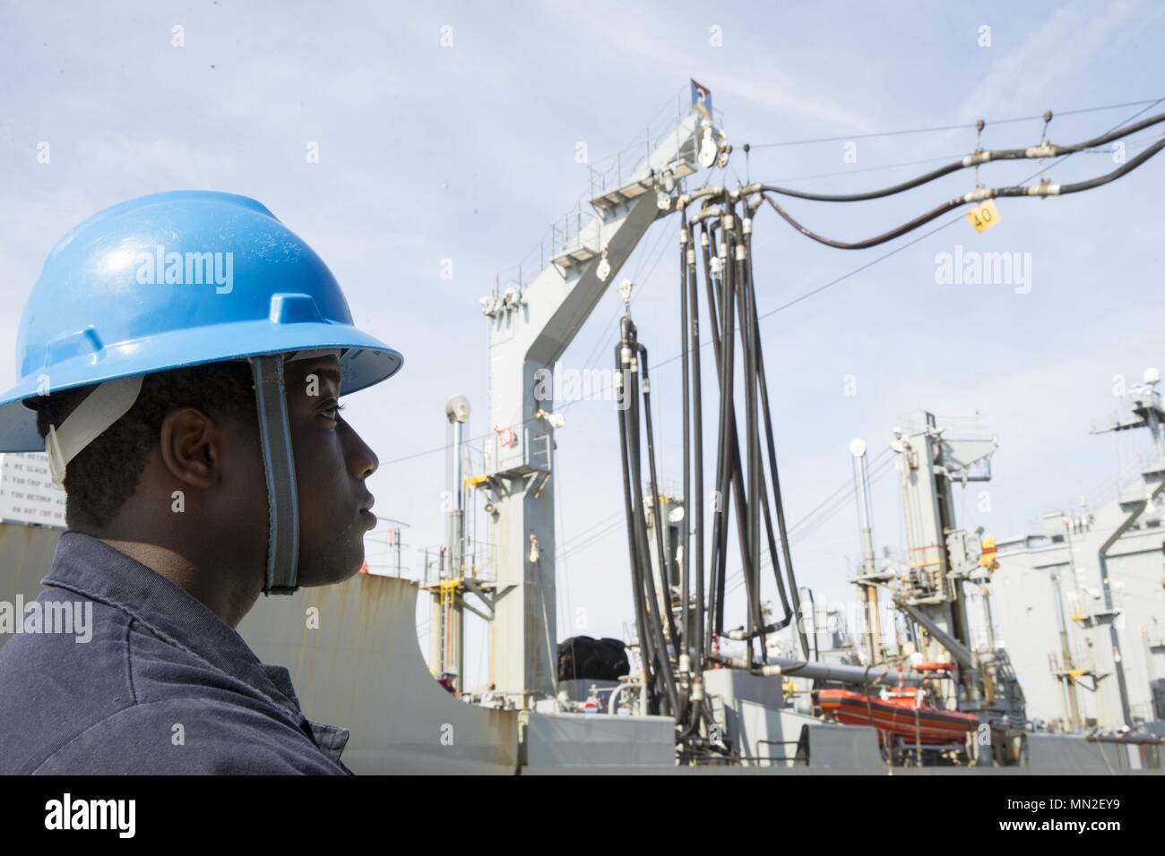 NORFOLK, Va. (May 10, 2018) -- Boatswain's Mate 2nd Class Tyler Wall, from Hardeeville, South Carolina, assigned to USS Gerald R. Ford's (CVN 78) deck department, stands fuel hose watch during a simulated replenishment-at-sea with USNS Leroy Grumman (T-AO 195) at Naval Station Norfolk, May 10, 2018. Ford is conducting test and evaluation operations. (U.S. Navy photo by Mass Communication Specialist 2nd Class Kristopher Ruiz). () Stock Photo