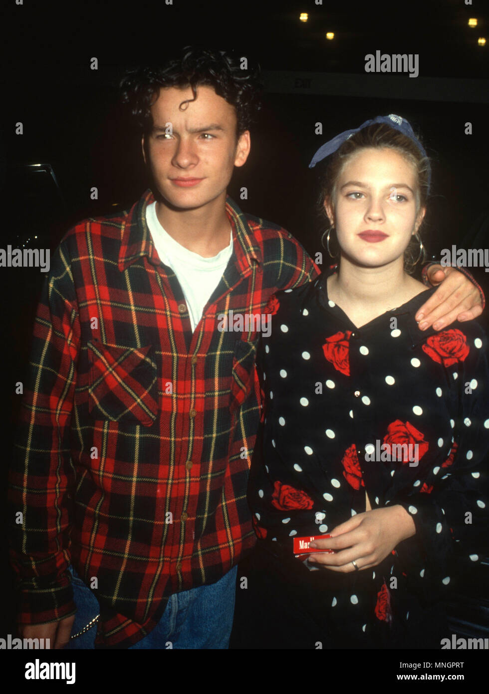 WESTWOOD, CA - SEPTEMBER 24: (L-R) Actor Balthazar Getty and actress Drew Barrymore attend the 'Pacific Heights' Westwood Premiere on September 24, 1990 at Avco General Cinemas in Westwood, California. Photo by Barry King/Alamy Stock Photo Stock Photo