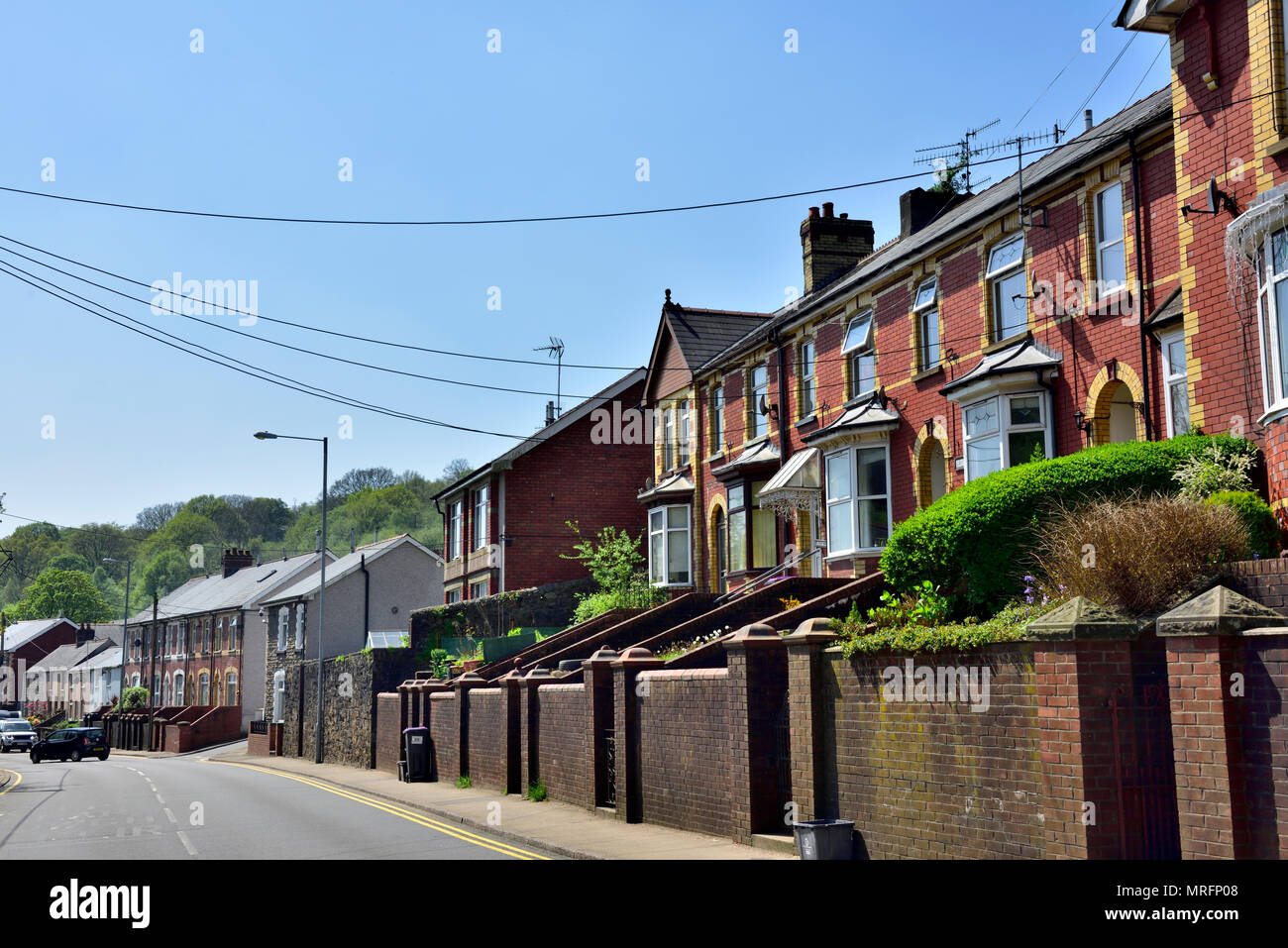 Row of traditional terraced houses along main street in Abersychan, near Pontypool, south Wales, UK Stock Photo