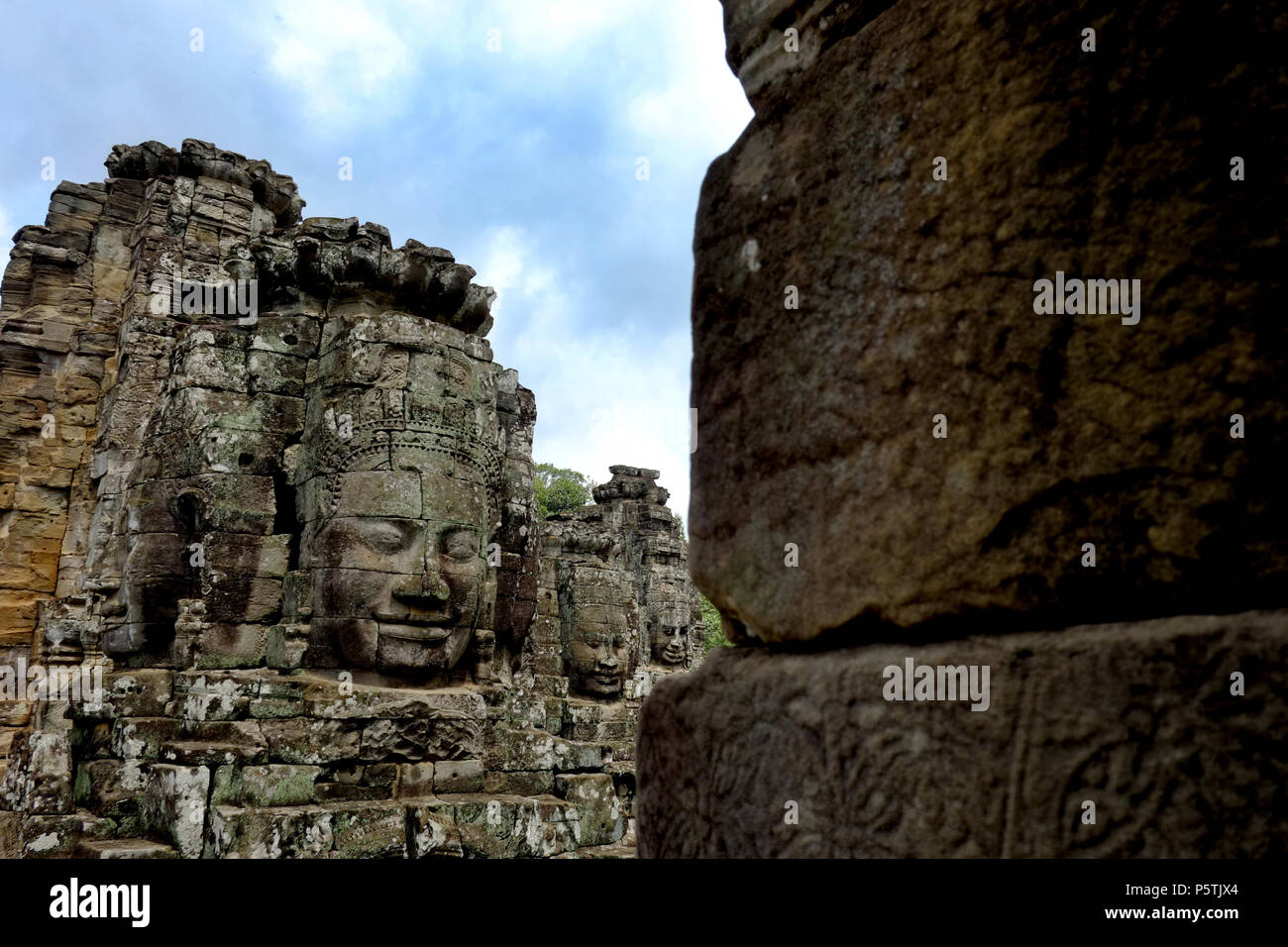 Smiling faces of the Bayon Temple in Siem Reap, Cambodia. Built in the late 12th or early 13th century by King Jayavarman VII. Stock Photo