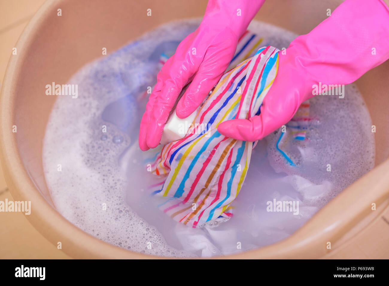 Wash clothes with soap. Stock Photo