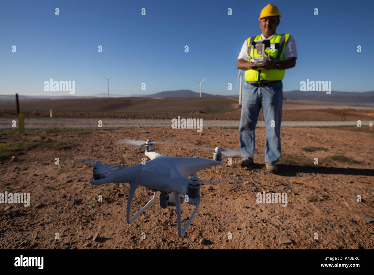 Engineer controlling a drone with a controller Stock Photo