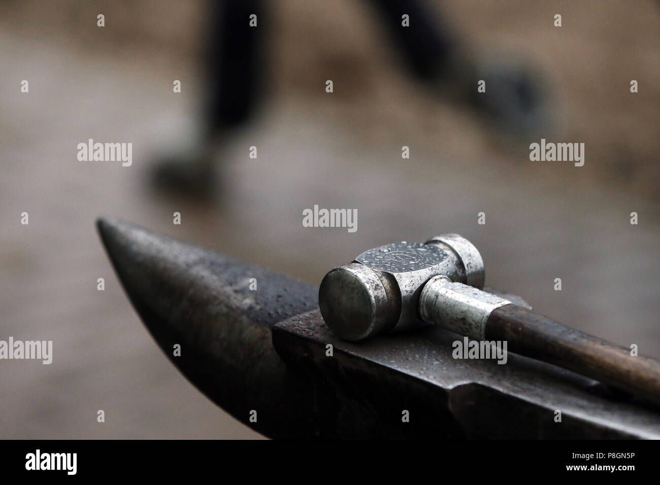 Neustadt (Dosse), hammer on an anvil Stock Photo