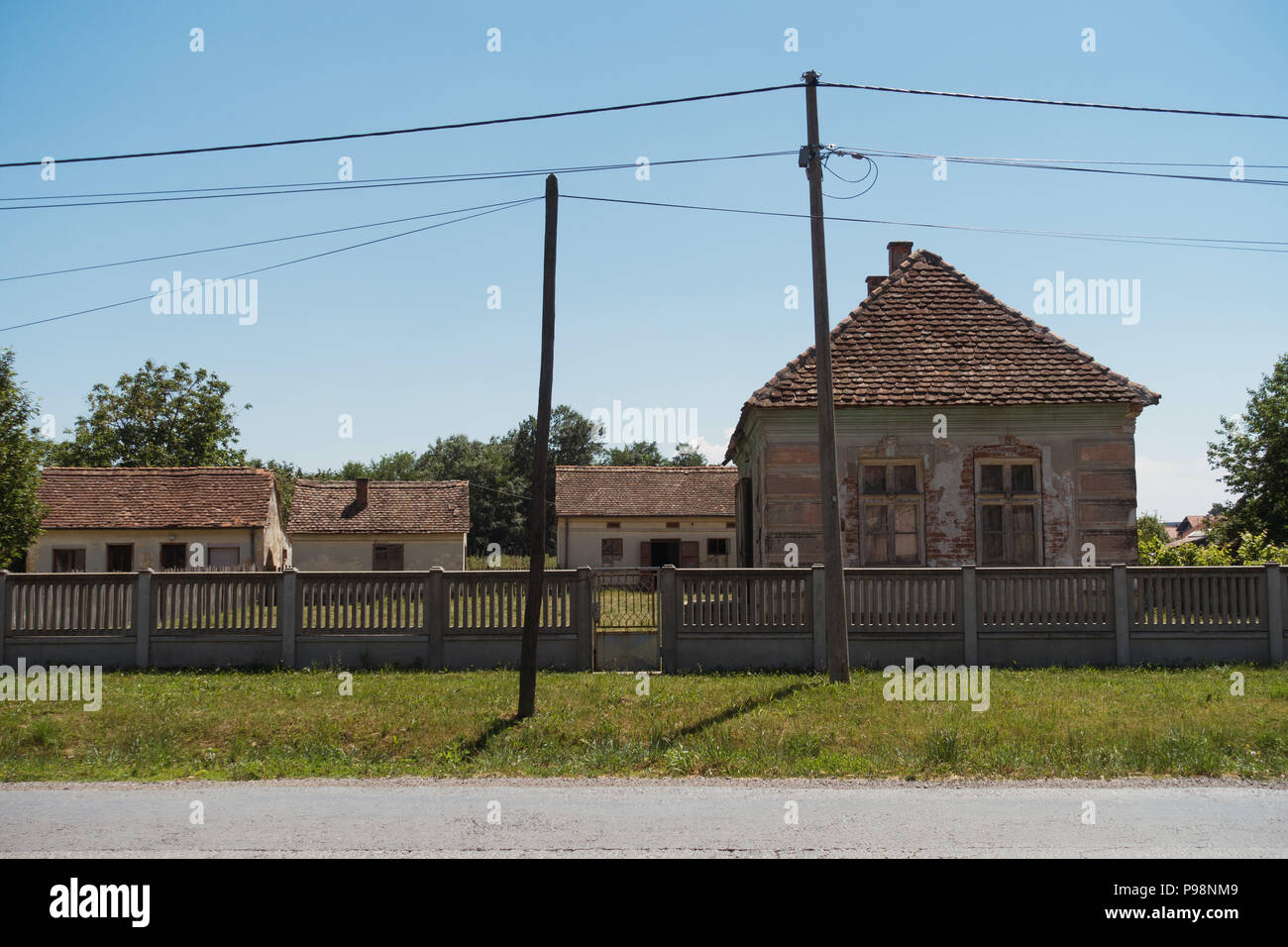 A traditional style rural Bosnian house with a tiled roof Stock Photo